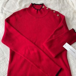 Calvin Klein mock sweater turtleneck. Ribbed with black trim and gold buttons.